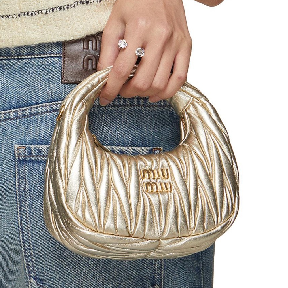 Miu Miu Wander Matelassé Nappa Leather Mini Hobo Bag in light gold.